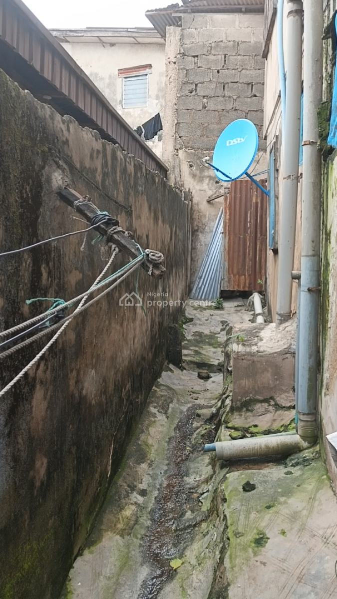 One Full Plot of Land with Demolishable Building in Ogba Central, Orimolade Street Off College Road, Ogba, Ikeja, Lagos, Block of Flats for Sale