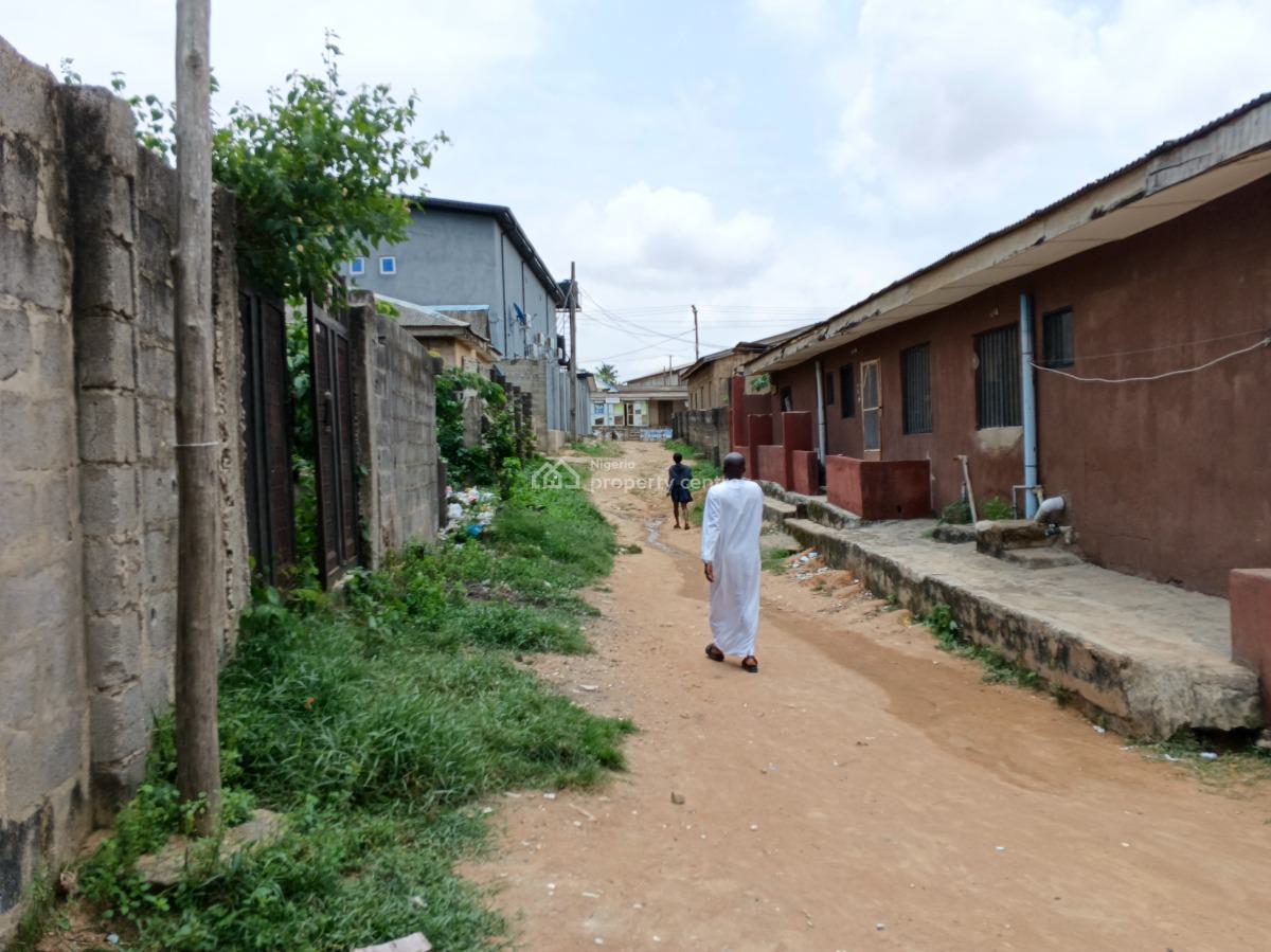 More Than Half Plot of Land Fence Gate Close to The Road, Ikola Command, Ipaja, Lagos, Mixed-use Land for Sale