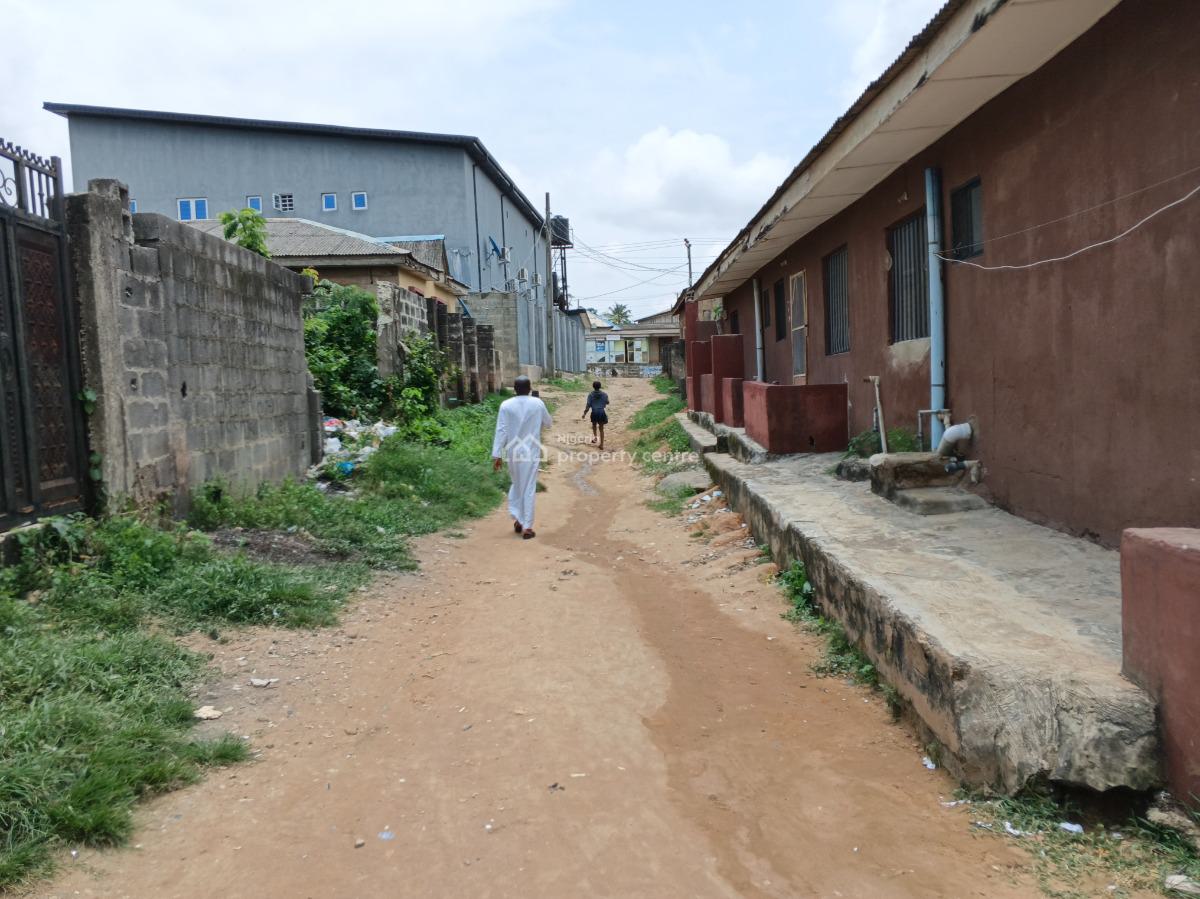 More Than Half Plot of Land Fence Gate Close to The Road, Ikola Command, Ipaja, Lagos, Mixed-use Land for Sale