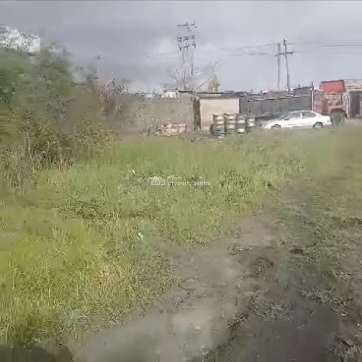 4300sqm Land with Structure  Good for:- Factory, Trailer/truck Park,, Directly Along Oshodi/ Apapa Express Way., Oshodi, Lagos, Commercial Land for Sale