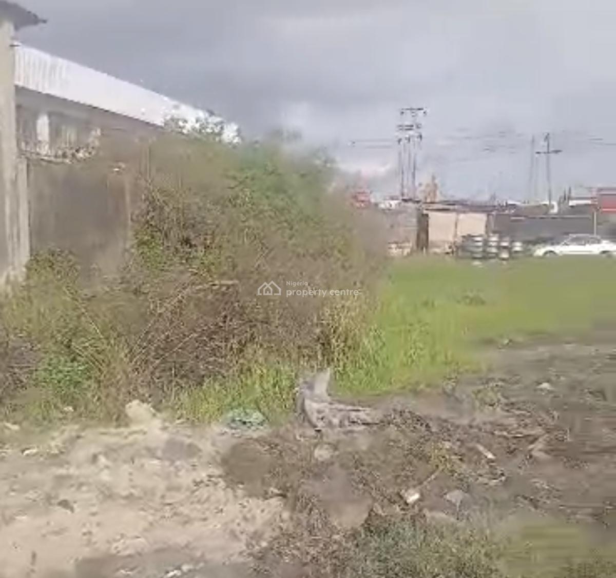 4300sqm Land with Structure  Good for:- Factory, Trailer/truck Park,, Directly Along Oshodi/ Apapa Express Way., Oshodi, Lagos, Commercial Land for Sale