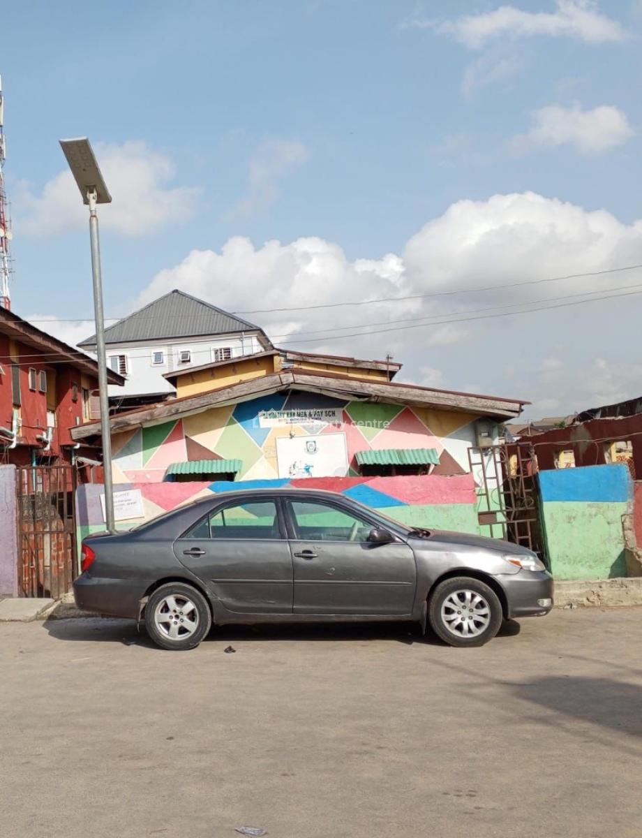 a Bungalow and a Story Building on a Half Plot of Land, Off  Pedro Road, Bariga, Shomolu, Lagos, Block of Flats for Sale