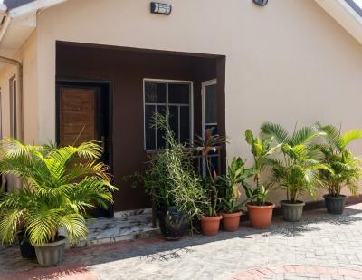 Solid Bungalow Sitting on a Plot of Land with Multiple Units