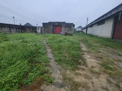 A Warehouse Sitting on 3-Plots of Land Directly Facing the Expressway