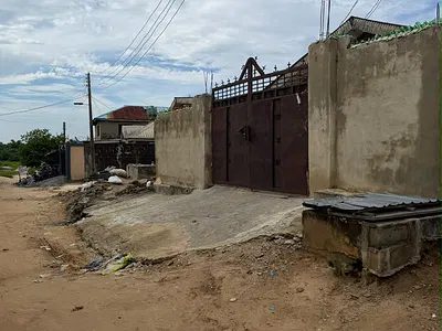 A Residential Building Sitting on Half Plot of Land