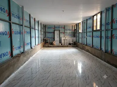 An Open Plan Office Space Facing a Major Road