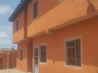 A Block of Flats of 4 Units of 2 Bedroom Flats N 12 Units of Mini Flat