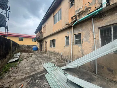 Land Measuring 560SQM Wit 4 Units of 3bedroom Flats on It in a Secured
