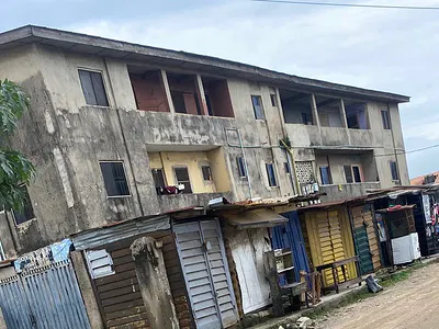 Land with an Old Two Story Structur Facing the Road