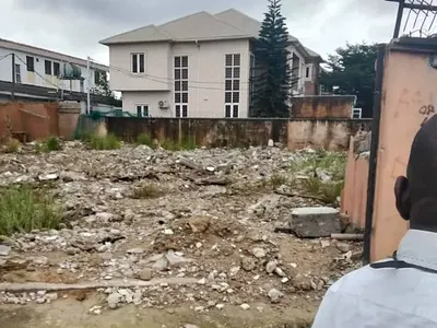 A Vacant Plot of Land Fence and Gated