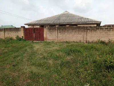 6 Plots of Land in a Secured Area with Cofo
