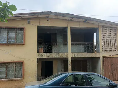 A Storey Building of 16 Rooms Facing the Road