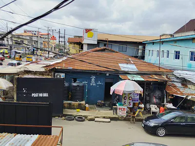 A Bungalow Comprising Several Rooms / Shops Standing on a Plot of Land — Awofeso Street by Shipeolu Street, Palmgrove, Shomolu, Lagos