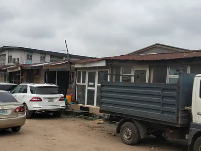 Corner Piece Land with Mini Warehouse on 718SQM — Isolo, Lagos