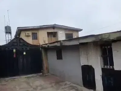 986SQM Commercial Land with Demolishable Structure — Directly on International Airport Road, Mafoluku, Oshodi, Lagos