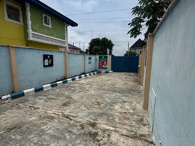 Land with Two Storey Building — Voera Estate, Berger, Arepo, Ogun